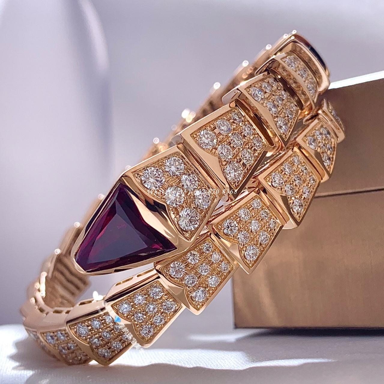 Bulgari Serpenti one-coil bracelet in 18 kt rose gold, set with full pavé diamonds and a rubellite on the head Ref.: 347602